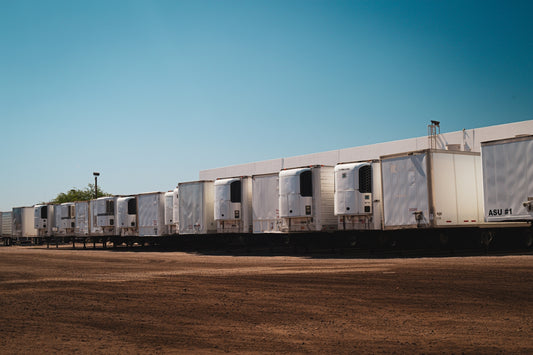 A row of semi trucks parked next to each other