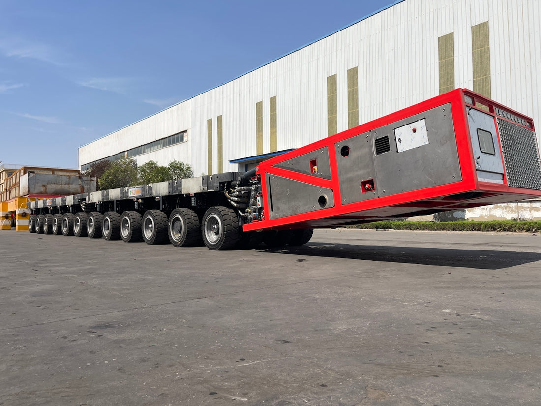Heavy-duty trailer with multiple axles carrying large equipment