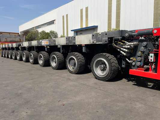 Heavy duty trailer with multiple wheels and hydraulic system