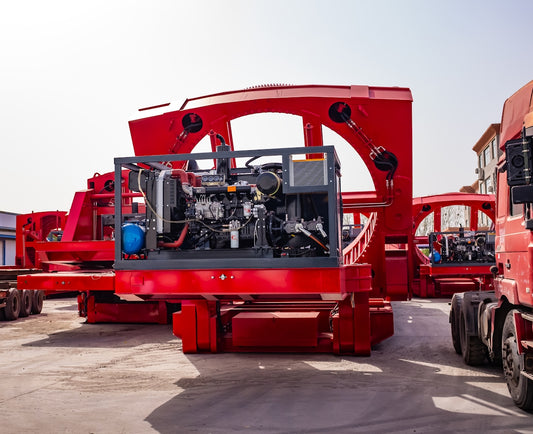 Large red industrial machinery with engine components.